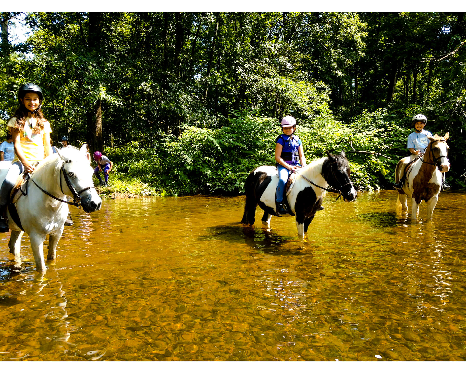 Girls On Horseback in River